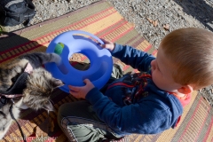 Mason helps Gypsy with her new toy.