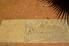 Sidewalk memorial to an elegant saloon once on this plaza.