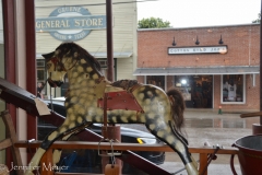 Old rocking horse in the front window.