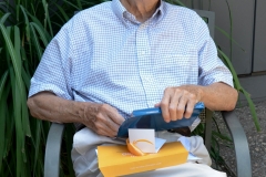 Dad opens a present that arrived from my sister.